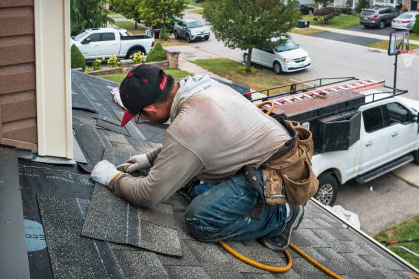 Professional Roofing technician working in Avon, MA